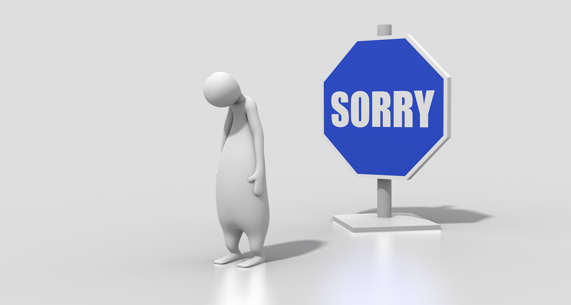 personnage désolé à côté d'un panneau sur lequel il est écrit "sorry"